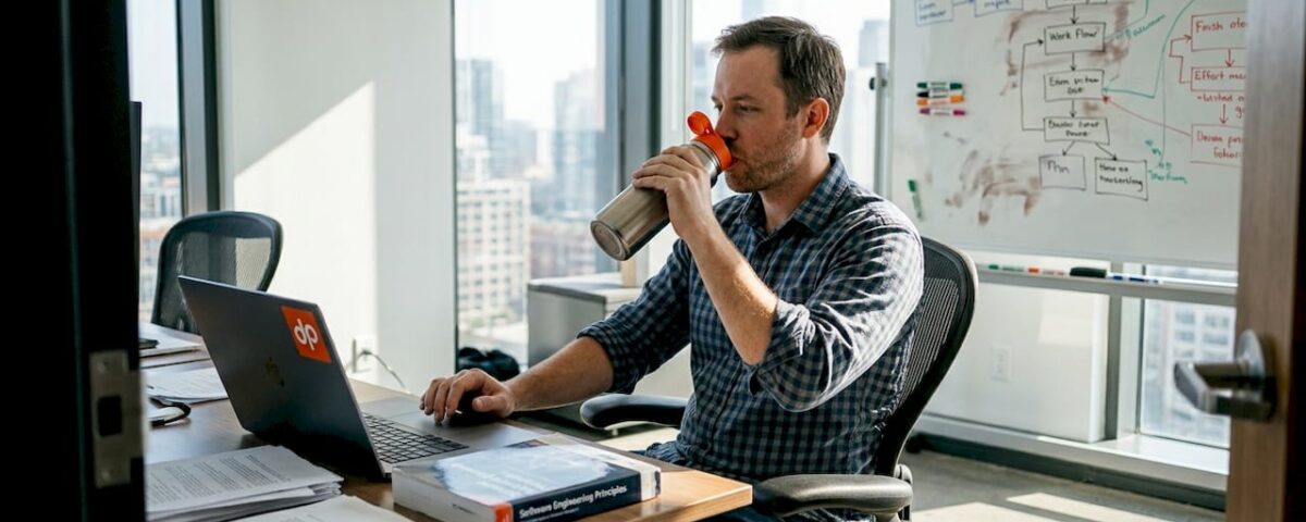 Engineering manager reviews workflow schedule in office