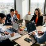Team collaborating in corner office workspace