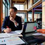 IT manager reviewing outsourcing contract documents