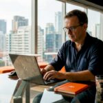 Developer coding at desk in startup office