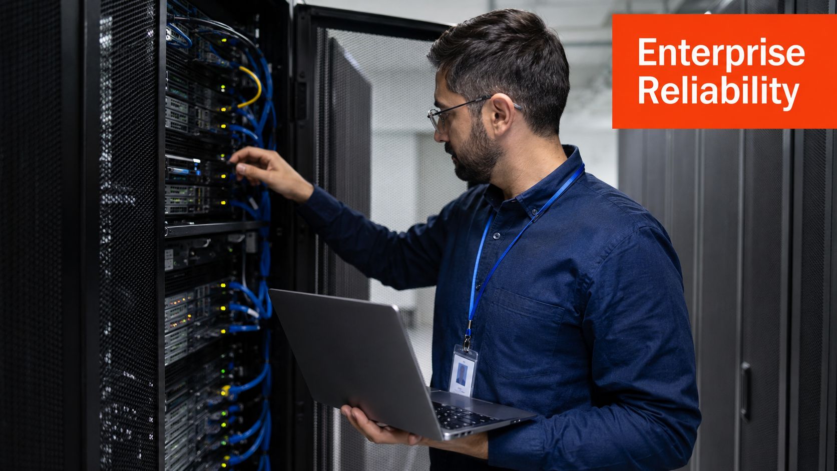 A professional IT technician inspecting and configuring server hardware equipment inside a modern data center facility.